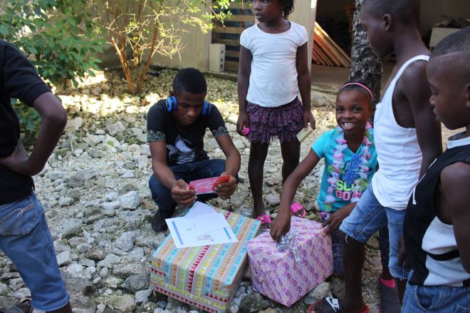 Orphans opening their Christmas gifts 2